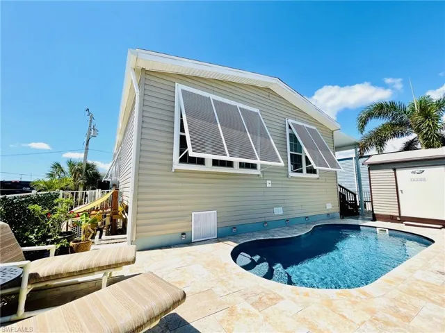 Back of property featuring a patio area