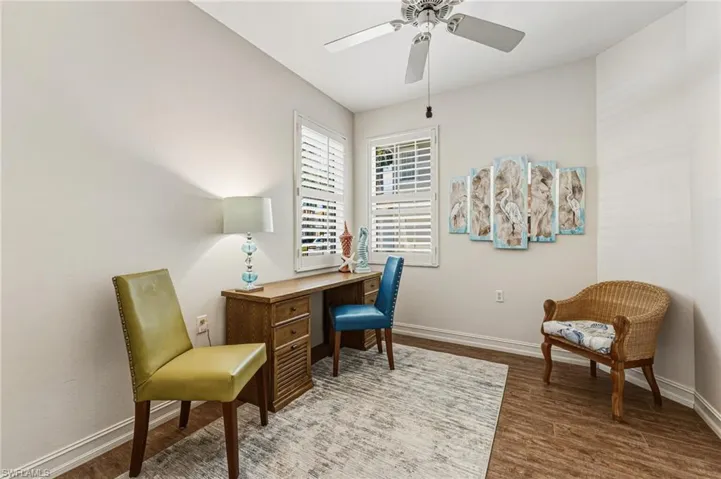 The office/den offers endless possibilities, making it an ideal space for an artist, enhanced by abundant natural light that fills the room. Tile flooring adds durability and a clean, polished finish.