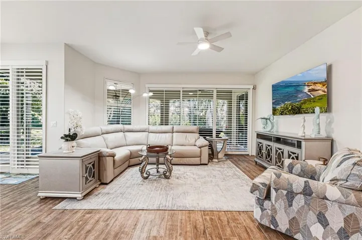Stunning plantation shutters span the living room sliders and continue into the breakfast room, creating a cohesive and elegant look throughout.
