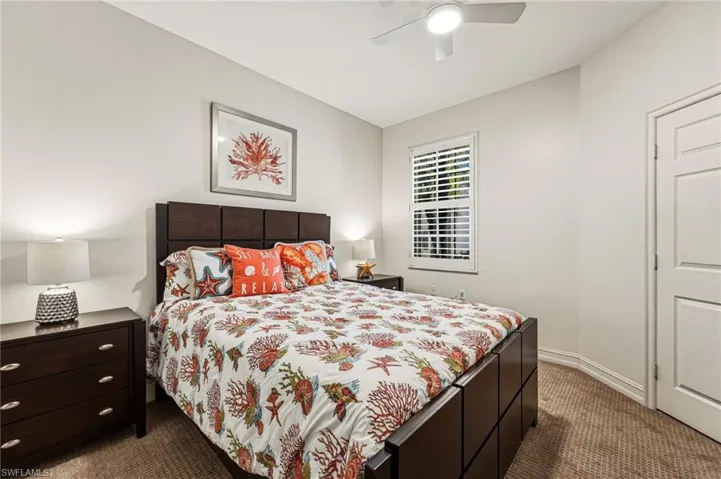 he second bedroom features abundant natural light, plantation shutters, and upgraded carpeting, offering a comfortable and inviting space.