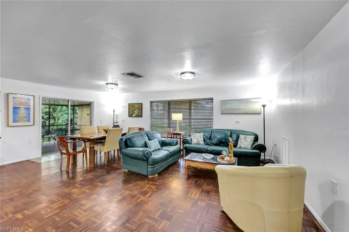 Open floor plan featuring living-room, dining-room and entrance to back lanai.