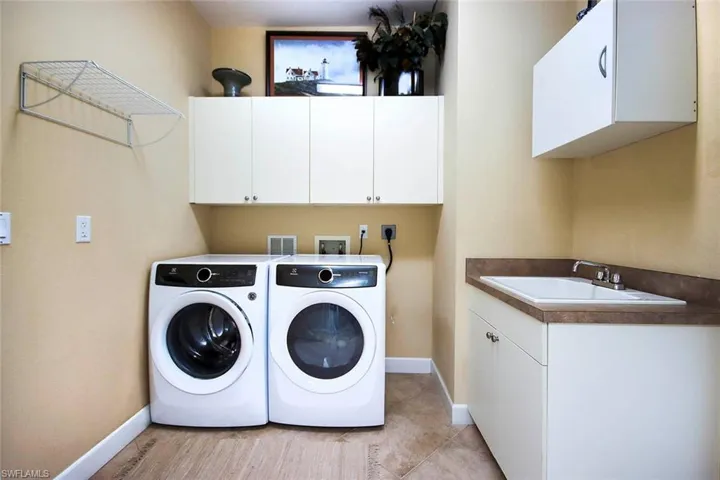 BIG laundry room with lots of additional storage