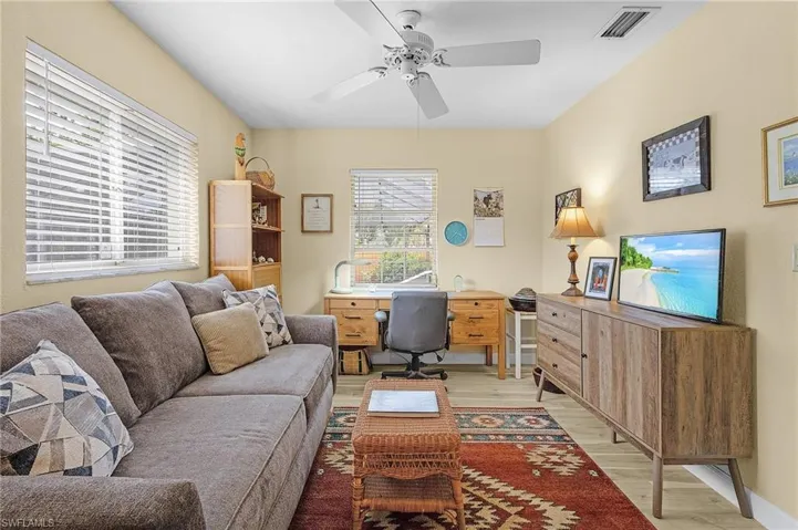 Office area featuring ceiling fan and light hardwood / wood-style floors
