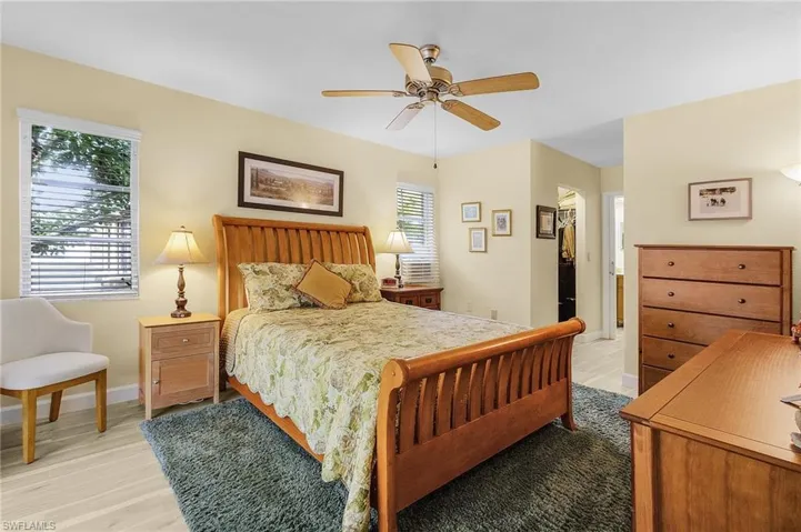 Bedroom with ceiling fan and light hardwood / wood-style floors