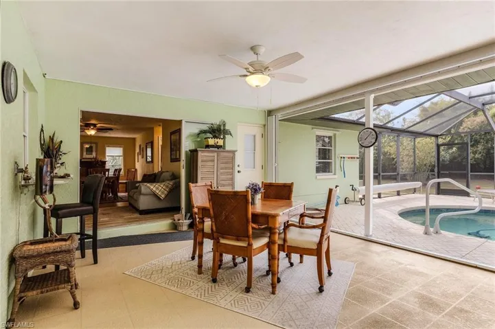 Dining area on lanai featuring ceiling fan