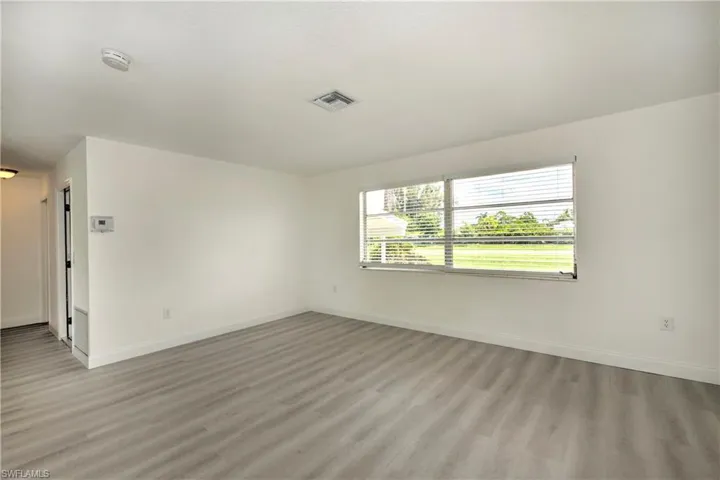 Spare room with wood-type flooring