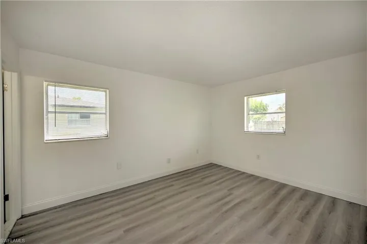 Empty room with wood-type flooring