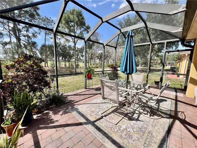 View of patio featuring a lanai and outdoor dining area