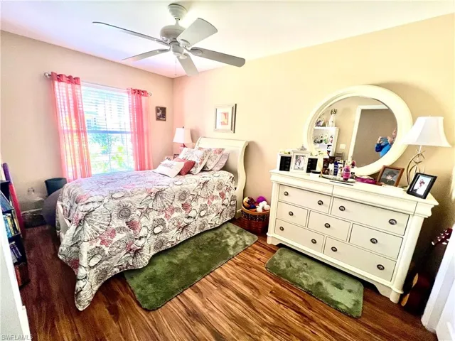 Bedroom featuring wood finished floors and ceiling fan