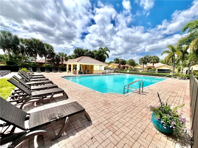 Resort style Pool with a patio and fence