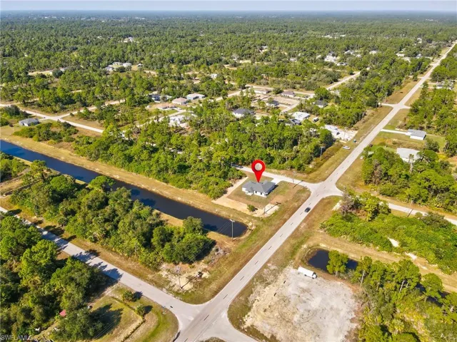 View of property location featuring a heavily wooded area