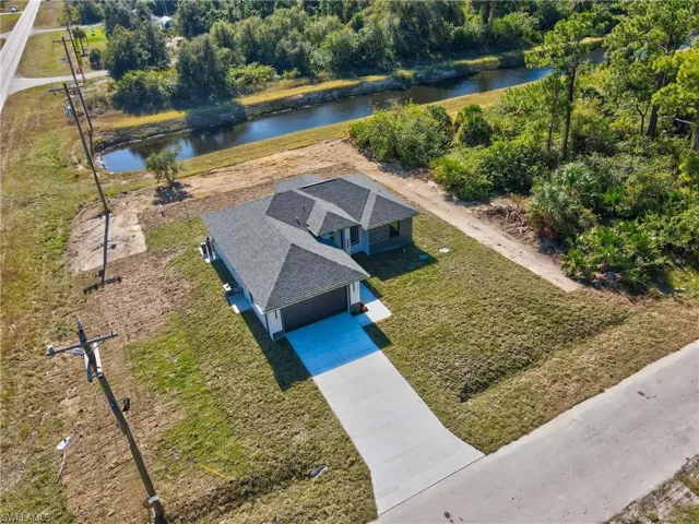 View from above of property with a large body of water