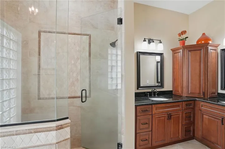Primary Bathroom featuring a stall shower and vanity