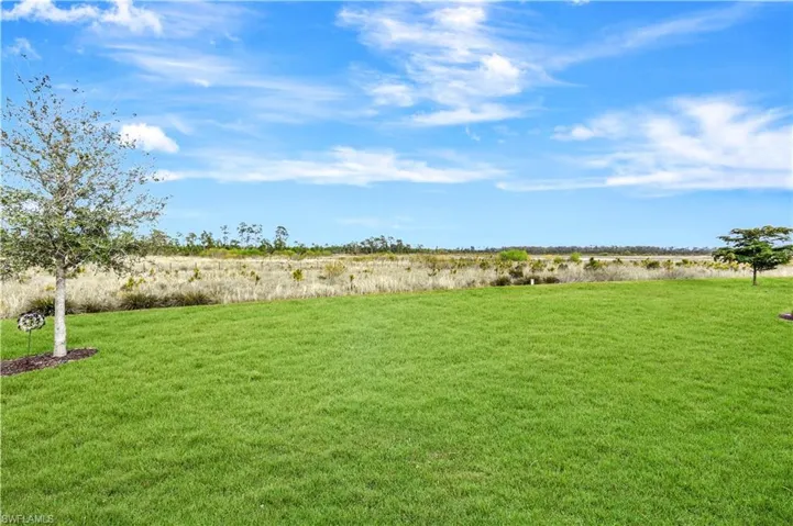 View of yard with a rural view