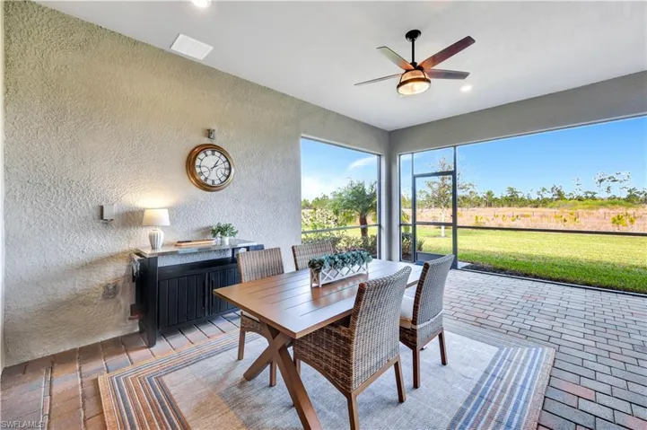 Sunroom / solarium with ceiling fan and visible vents