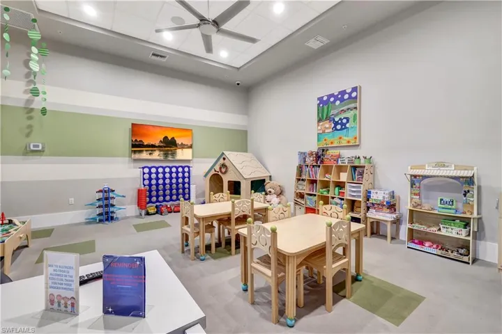 Recreation room with visible vents, a ceiling fan, and baseboards