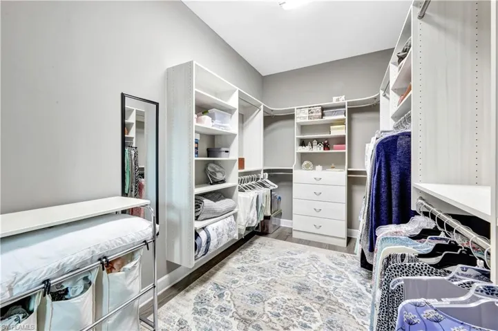 Spacious closet featuring wood finished floors