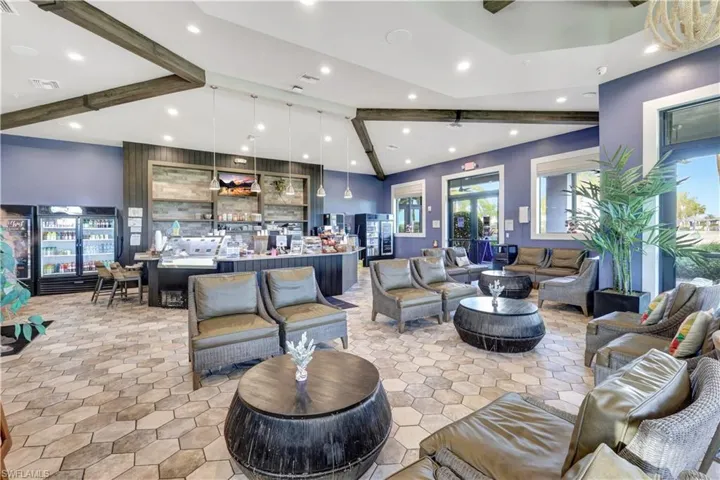 Living room with lofted ceiling with beams, a healthy amount of sunlight, visible vents, and recessed lighting