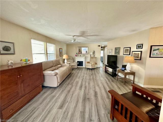 Cheerful, open living room with leather recliner.