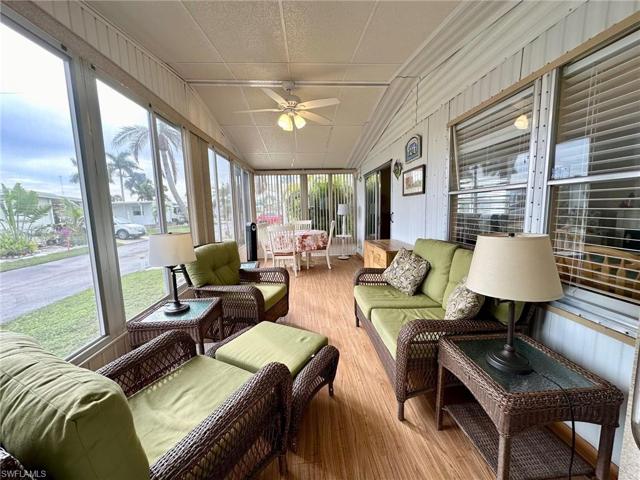 Enjoy balmy Florida breezes in the front Florida Room.