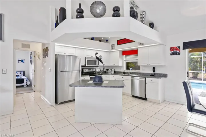 Kitchen with practical workspace and easy flow to dining area.