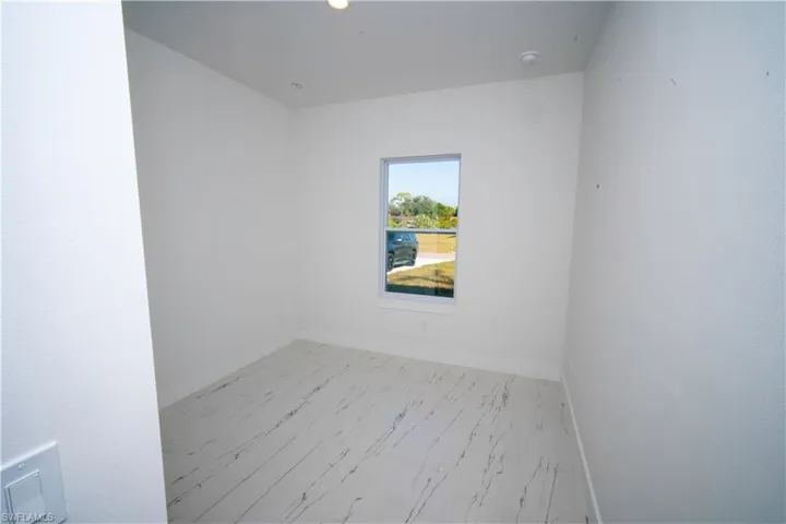 Unfurnished room featuring baseboards