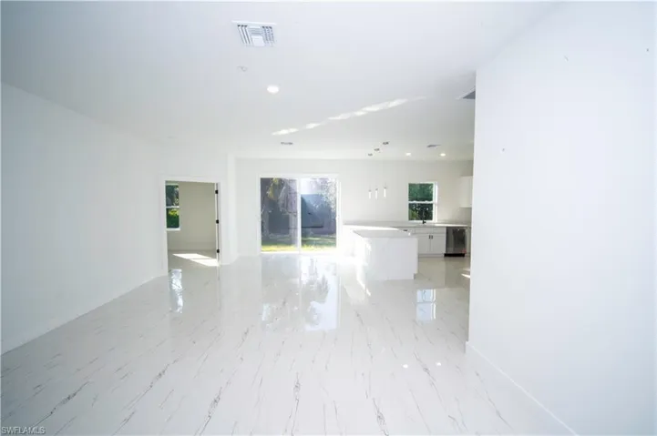 Spare room featuring recessed lighting and light marble finish floors