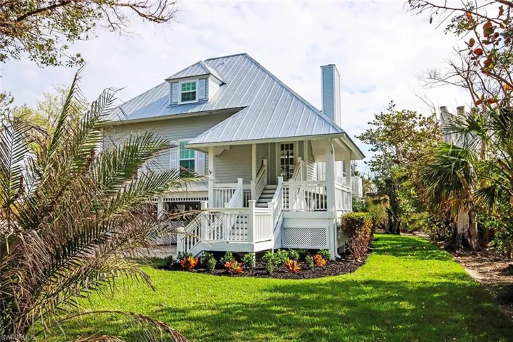 View of front of home featuring a porch and a front lawn