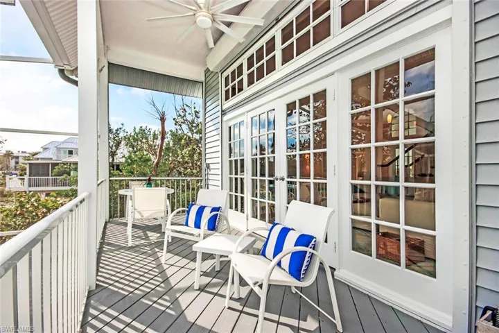 Balcony featuring french doors and ceiling fan