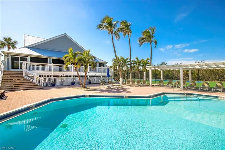 View of swimming pool featuring a patio area and a pergola