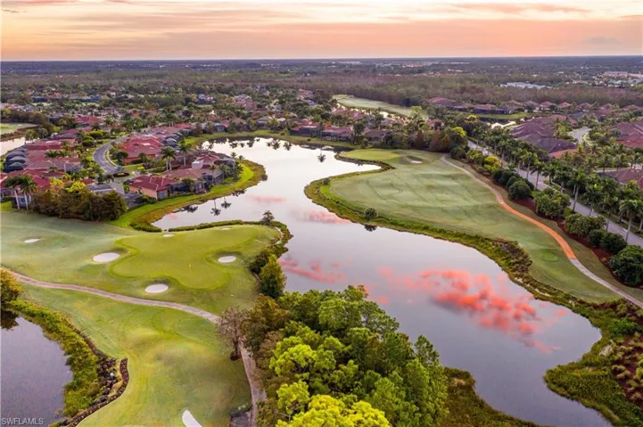 Bird's eye view with view of golf course and a water view
