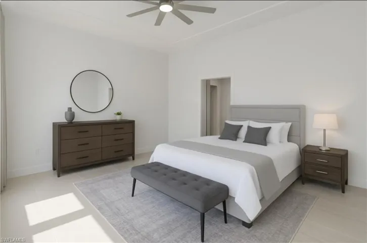 Bedroom with light tile patterned floors, baseboards, and ceiling fan
