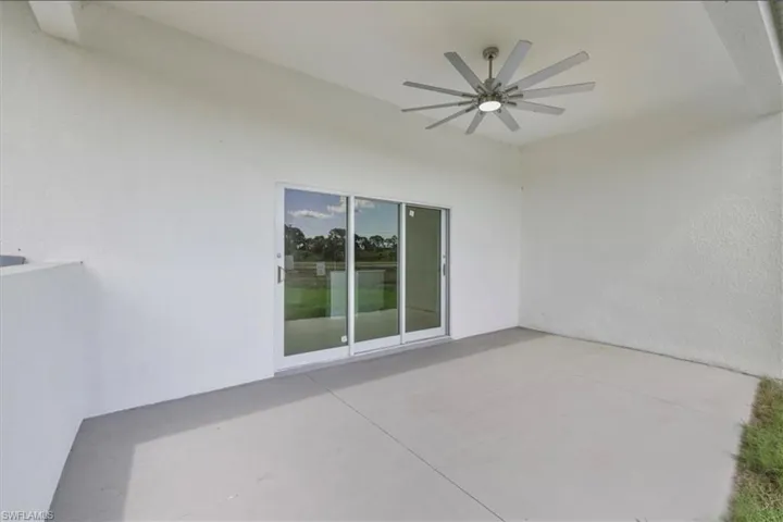 View of patio featuring ceiling fan