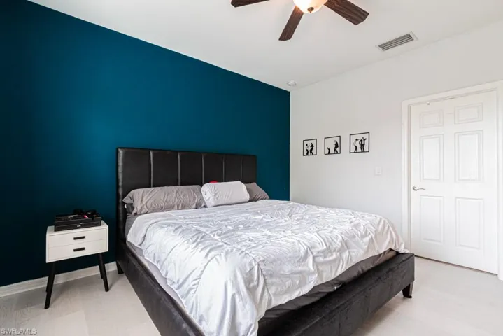 Bedroom featuring ceiling fan and light hardwood / wood-style floors