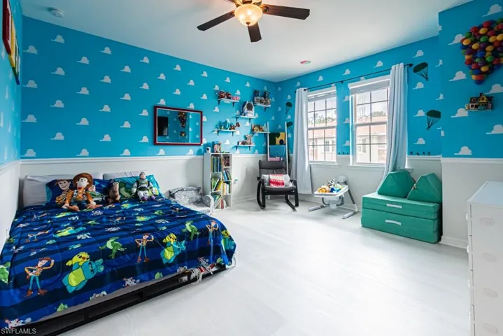 Bedroom featuring ceiling fan and hardwood / wood-style flooring