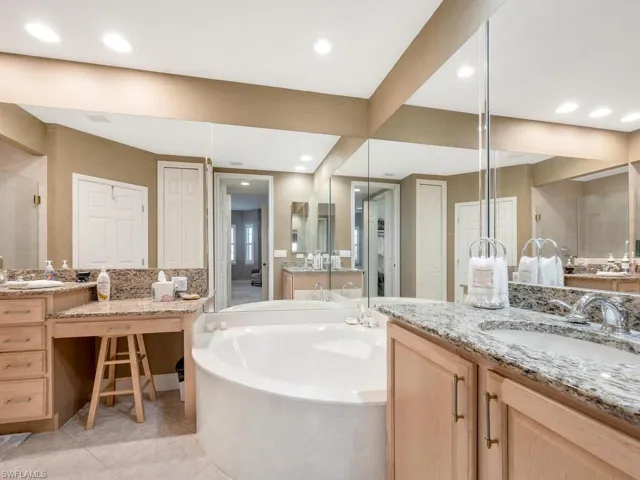 Double vanities, tub & separate shower.