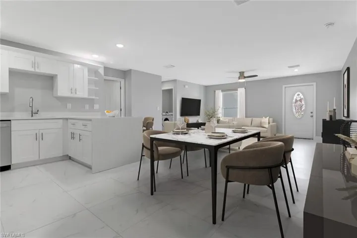 Dining room with sink and ceiling fan
