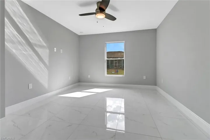 Unfurnished room featuring ceiling fan