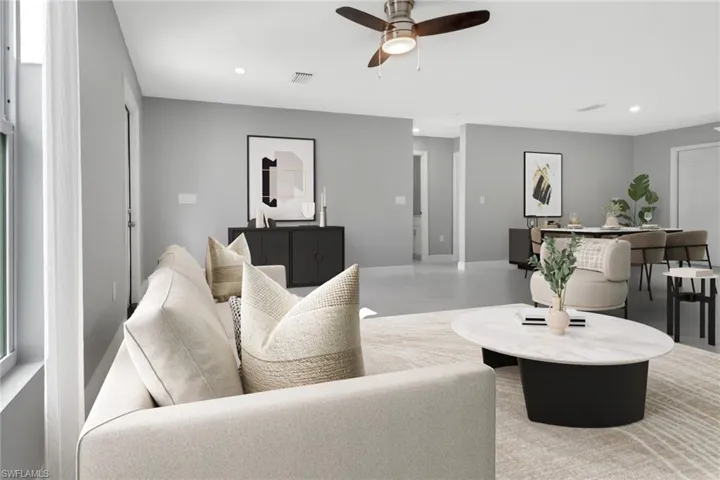 Living room featuring ceiling fan