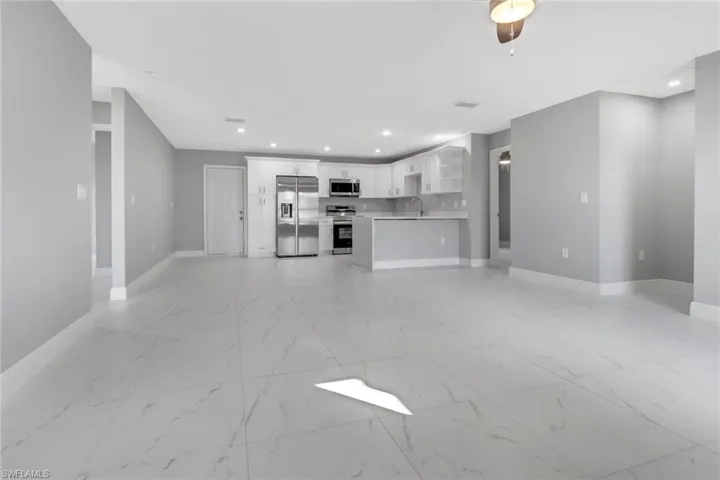 Unfurnished living room with sink