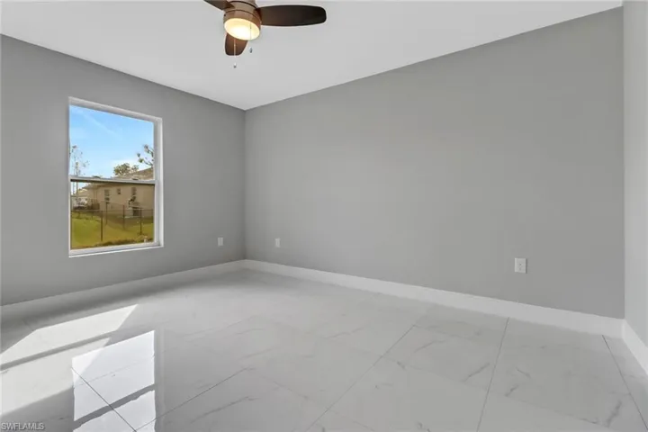 Spare room with ceiling fan