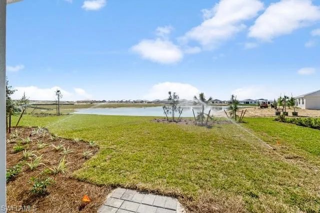 View of backyard with a water view