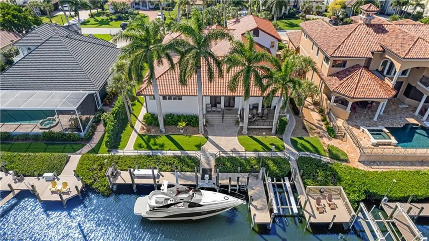 Your dock can accomodate a 48" yacht.  8000 lb lift on the right as well as the tiki deck on the right belongs to this awe inspiring property!