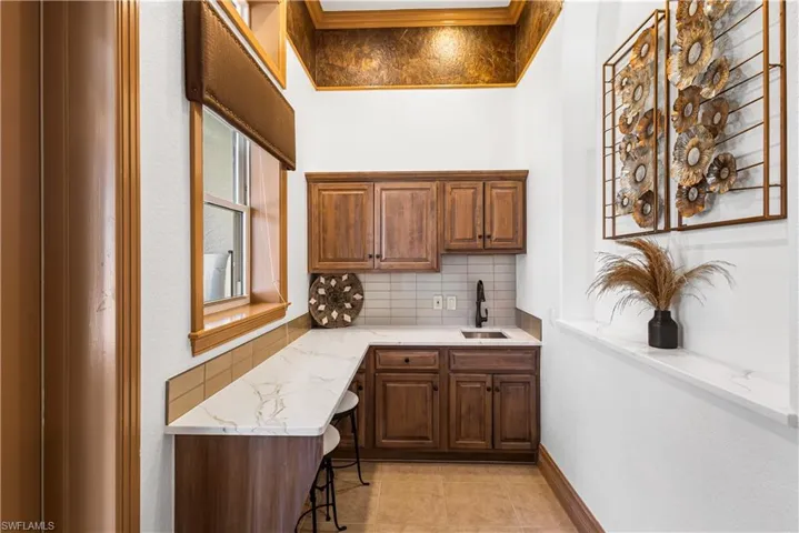 Casita Kitchenette with Cambria Quartz Countertop, Comfort Height Seating, Single Sink and Cabinetry and A Private Entrance to the Outdoor Kitchen!