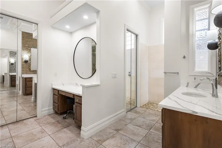 Makeup Vanity in Master Ensuite Bathroom and a Walk In Utilities Closet with a HWH. 2 Oversized Custom Designed Walk In closets.