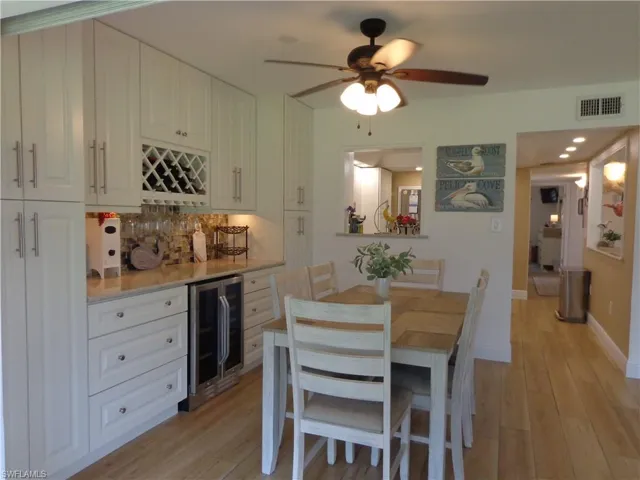 CHECK OUT THIS GORGEOUS DINING AREA!  THESE BUILT-INS ARE THE SAME HIGH QUALITY CABINETRY, WITH SOFT CLOSE DOORS AND DRAWERS, PULL-OUT DRAWERS AS WELL, A WINE RACK, A DOUBLE DOOR BEVERAGE CHILLER, QUARTZ COUNTERS, UNDER CABINET LIGHTING AND A BEAUTIFUL TILED BACKSPLASH.  THIS ADDED STORAGE SPACE IS A STUNNINGLY GORGEOUS ADDITION TO THIS FINE HOME!