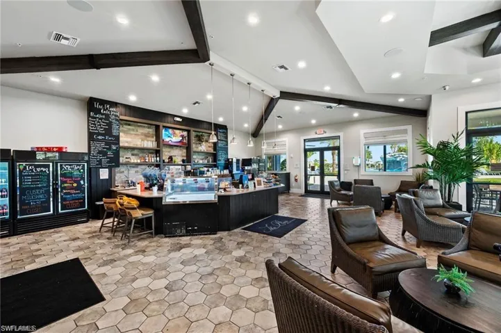 Reception with a community bar and recessed lighting