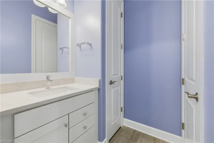 Bathroom featuring vanity and baseboards