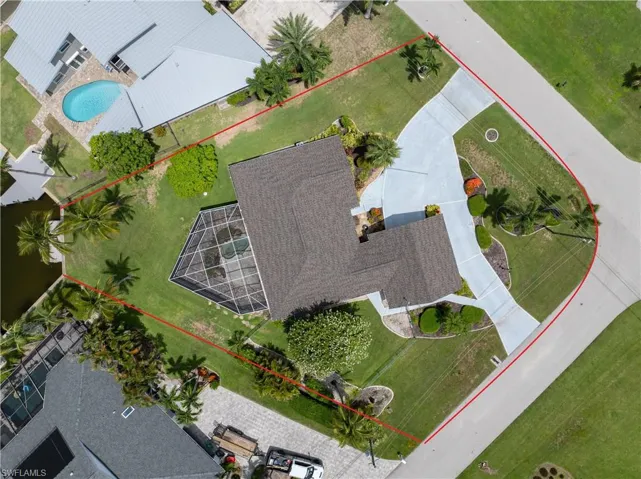 Aerial view of property's location with a pool and property parcel outlined