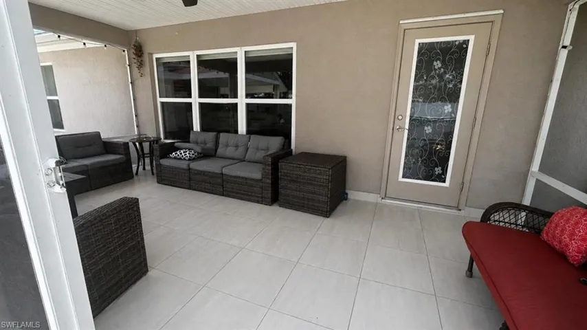 Spacious living area featuring neutral wall tones and a large window